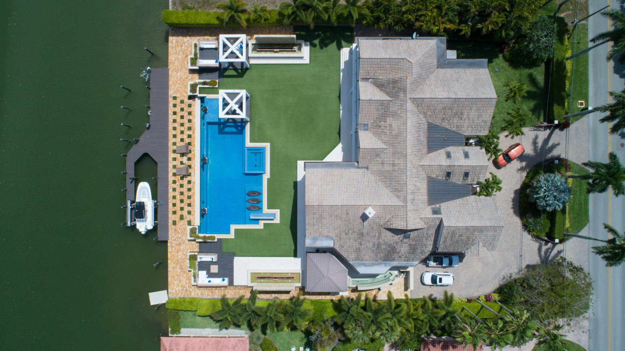 A bird’s eye view of a house with a pool