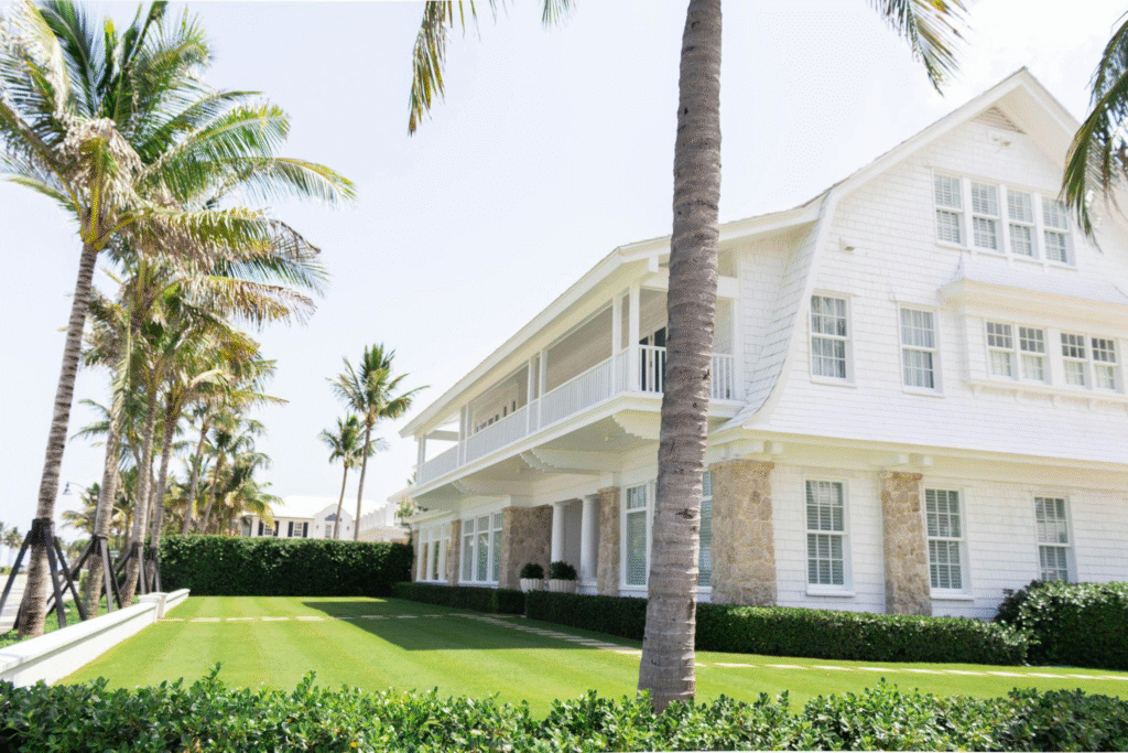 A white house near palm trees