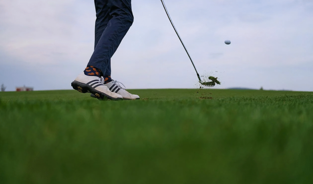 close up of a person playing golf in a country club
