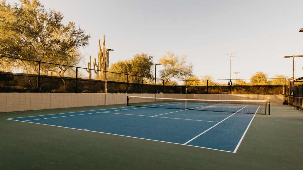 empty private tennis court in Boynton Beach’s gated community on a sunny day